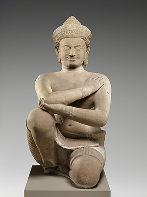 'Kneeling Attendant,' Angkor period, Cambodia, 10th century stone sculpture, Gift of Raymond G. and Milla Louise Handley, 1989 (1989.100). And Gift of Douglas Latchford, in honor of Martin Lerner, 1992 (1992.390.2). The artwork is currently on display in Gallery 249. Image courtesy of Metropolitan Museum of Art.