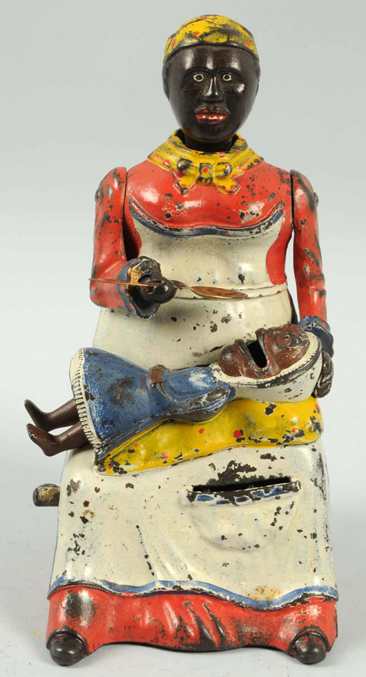 Kyser & Rex ‘Mammy with Spoon’ mechanical bank, est. $5,000-$7,000. Morphy Auctions image.