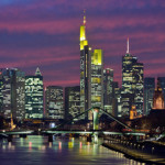 View of Frankfurt skyline at night from a photographic collage by Alphasinus. Image published with permission, under the terms of the GNU Free Documentation License, Version 1.2.
