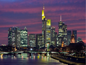 View of Frankfurt skyline at night from a photographic collage by Alphasinus. Image published with permission, under the terms of the GNU Free Documentation License, Version 1.2.