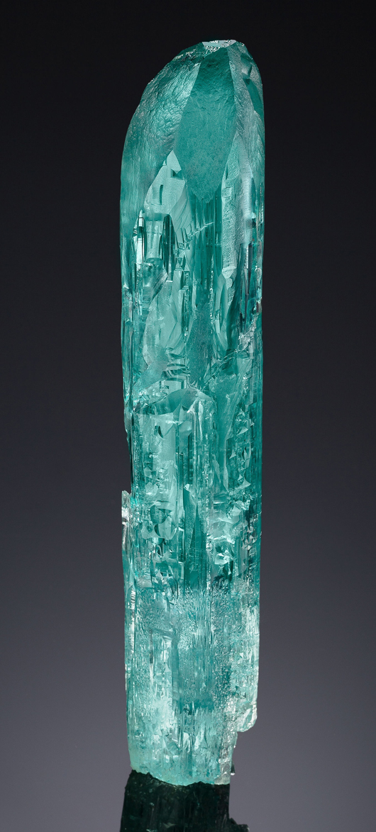 This gem-grade aquamarine crystal, 9 by 1.5 inches and unscathed since it was found in the early 1990s, realized $158,500. Heritage Auctions image.
