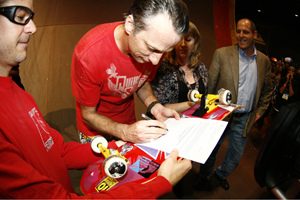 Tony Hawk signs deed of gift for his skatedeck. Photo by Lee Leal, Embassy Skateboards.