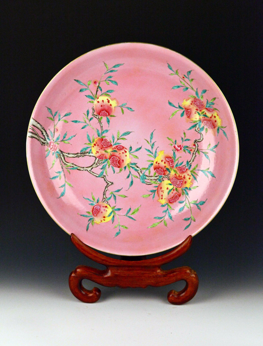 Large Famille Rose porcelain dish with longevity peach motif, 20 inches diameter. Estimate $1,200-$1,800. Linwoods image.