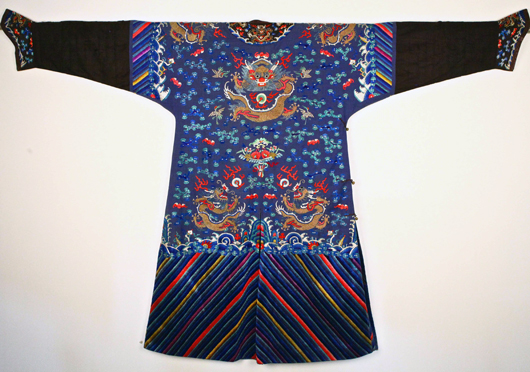 19th-century Chinese silk robe. Multicolor embroidered decoration with dragons and cranes flying amongst the clouds with gold thread detail and gold buttons, 85 inches long. Estimate $4,000-$6,000. Linwoods image.