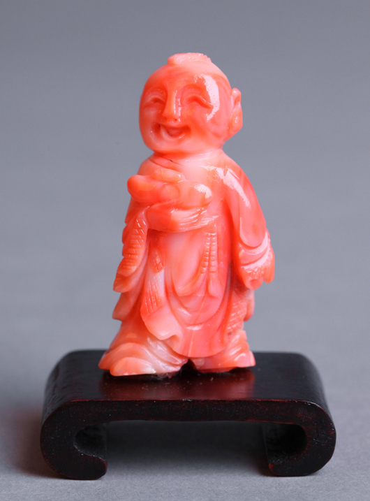 Coral figure of a boy, 2.75 inches tall. Estimate $1,000-$1,500. Linwoods image.