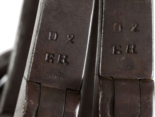 Maker's stamp on leg irons. The initials ER stand for Elijah Rickard, a well-known locksmith who operated out of Shepherdstown, Virginia. Heritage Auctions image.