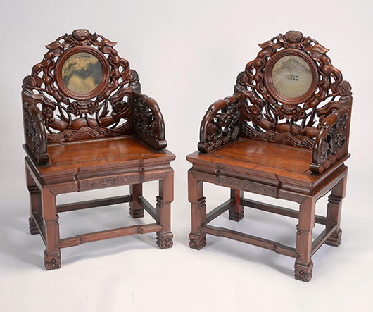 Pair of hardwood armchairs with marble insets. Sold for $26,550. Michaan's image.