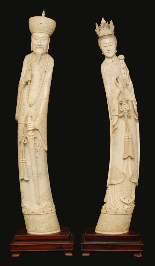 Large pair of Chinese carved African ivory tusks of a standing emperor and empress, 41in tall. Elite Decorative Arts image.