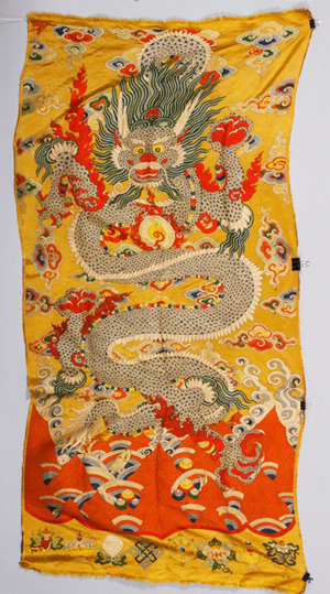 Imperial yellow embroidery, China, embroidered with five-clawed dragons among clouds and waves, 92 inches x 44 inches. Price realized: $11,000. Kaminski image.