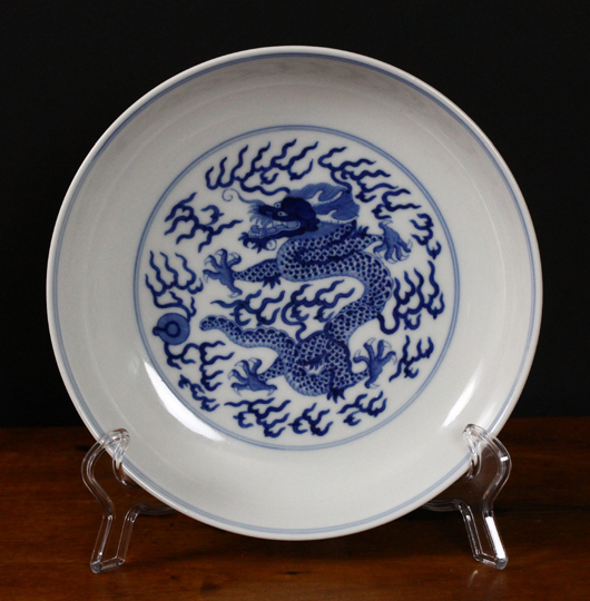 Chinese Guangxu blue and white dish, 7¼in dia., with underglaze blue six-character mark and of the period (1875-1908), featuring curled dragon and flaming pearl amongst thunderbolts. Est. $2,000-$3,000. Manatee Galleries image.
