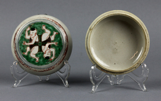 17th-century Chinese verte covered box, 4.1in dia., the lid painted with an image of two boys, possibly twins; 1950s label from Amsterdam gallery Kunstzalen A. Vecht, est. $3,000-$5,000. Manatee Galleries image.