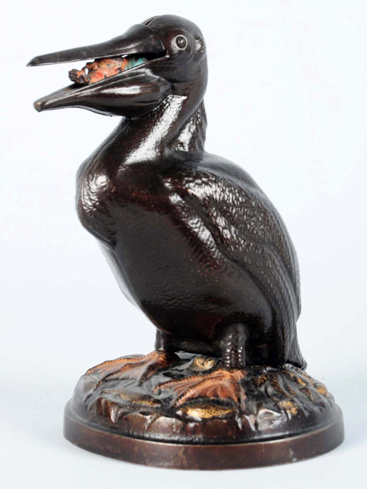 Pelican cast-iron still bank, $11,400. Morphy Auctions image.