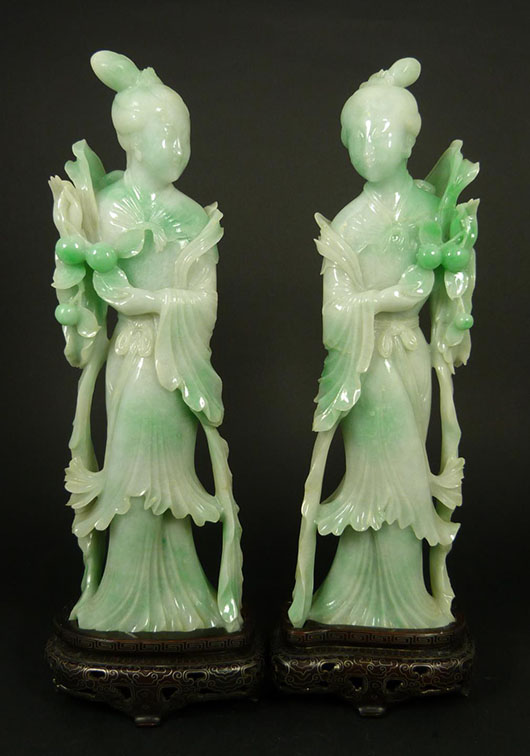 Pair of hand-carved Chinese jadeite Guan Yin sculptures, each one 11 1/4 inches tall. Price realized: $29,500. Elite Decorative Arts image.