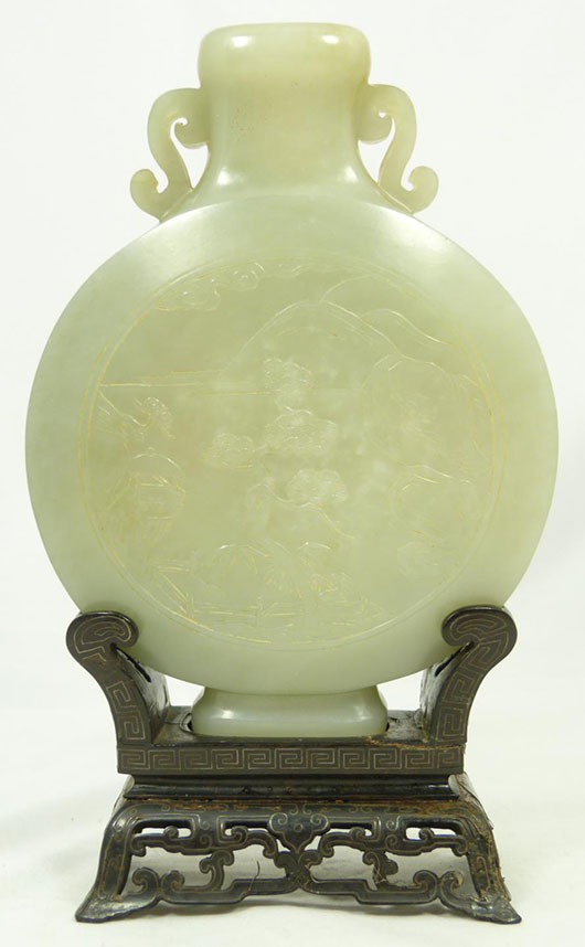 Chinese hand-carved celadon green jade moon flask vase with base, 6 1/4 inches tall. Price realized: $37,760. Elite Decorative Arts image.