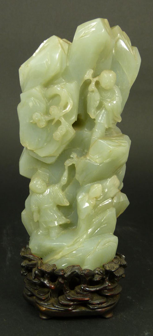 Chinese Qing Dynasty period hand-carved celadon jade figural mountain carving. Price realized:  $31,860. Elite Decorative Arts image.  