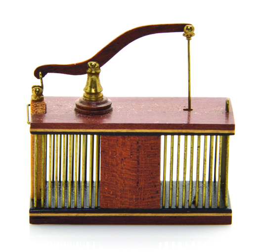 Acclaimed Miniaturist William R. Robertson built a better mousetrap. This tiny rodent trap of walnut, maple and ebonized wood captured $13,750 at the auction. Leslie Hindman Auctioneers image.