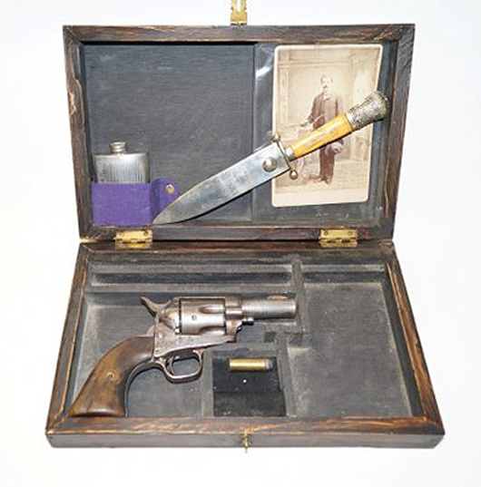 Cased 1875 Colt single-action revolver with bone-handle knife, pewter flask, and portrait photo taken at a Tombstone, Arizona Territory studio. Sold for $4,500 + buyer's premium in the July 17, 2013 auction session. Image courtesy of LiveAuctioneers.com and Guernsey's.