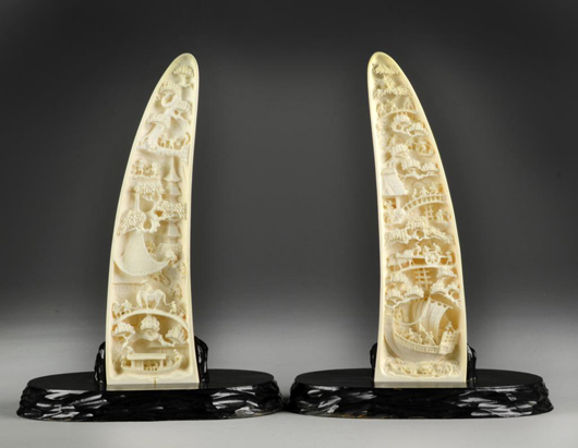 Pair of Japanese Meiji carved ivory tusk with stands. Midwest Antiques Galleries Inc. image.