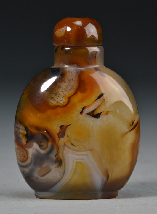 Chinese carved agate floater snuff bottle. Midwest Antiques Galleries Inc. image.