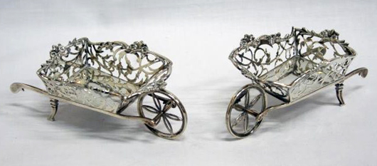Silver wheelbarrows by Willian Comyns & Sons, 1908/9. Unique Auctions image.