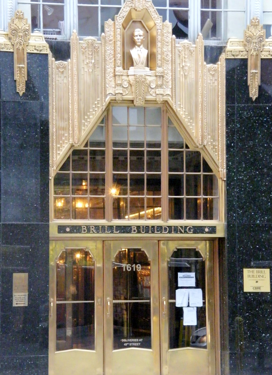 The entrance to the 1931 Brill Building, located at 1619 Broadway at 49th Street in Manhattan. Image by Americasroof at en.wikipedia. This file is licensed under the Creative Commons Attribution-Share Alike 3.0 Unported license.