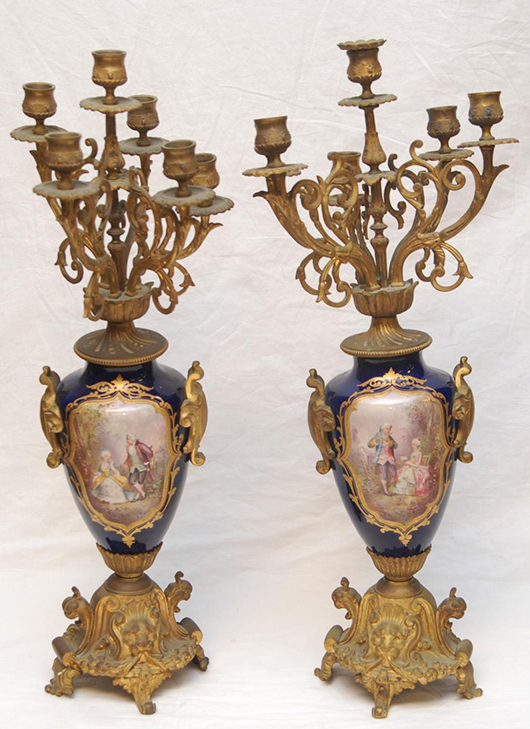 Pair of 19th century Sevres French porcelain six-arm candelabra, each having hand-painted scenes of courting couples and landscapes (est. $1,500-$2,500). Elite Decorative Arts image.