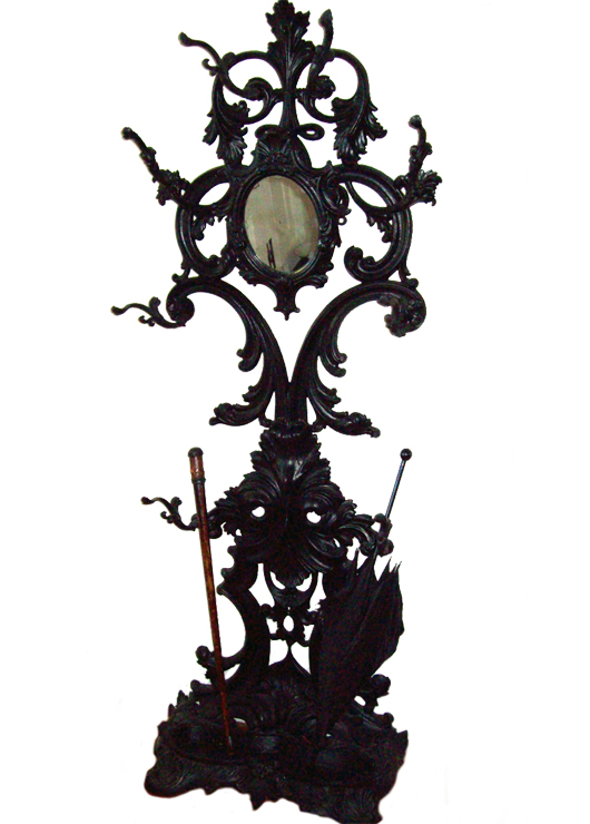 One of the few pieces of Victorian cast-iron furniture to make it inside from the garden is this Rococo hall stand from the 1870s in the Gregory House at Torreya State Park in Florida.