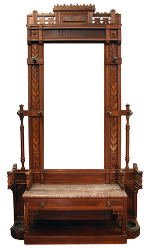 Showing the square outline and profuse linear decoration of the surface, this Eastlake hall stand is from the 1880s.