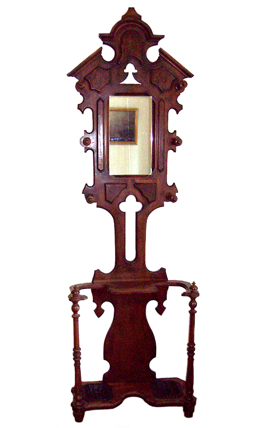 This is a tame example of the hall stand of the Renaissance Revival period of the 1870s.