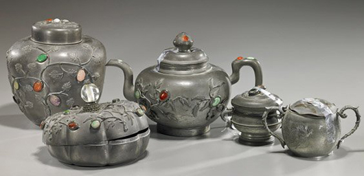 Group of old Chinese pewter vessels, including a three-piece tea set with teapot, creamer and sugar, all circa 1900. Estimate: $500-$700. I.M. Chait Gallery/Auctioneers image.