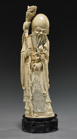 Chinese carved ivory figure of Shoulao, 11 inches. Estimate: $600-$800. I.M. Chait Gallery/Auctioneers image.