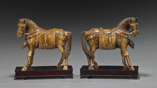 Pair Chinese carved and stained ivory horses, each with fancy caparison and furnishings with turquoise and coral ‘jewels,’ each 6 1/4 inches long. Estimate: $800-$1,000. I.M. Chait Gallery/Auctioneers image.