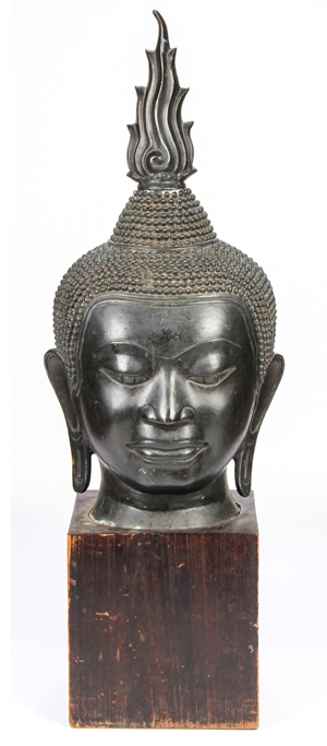 Large-scale Sukhothai Buddha head on a wood base. Estimate: $500-$700. Material Culture image.