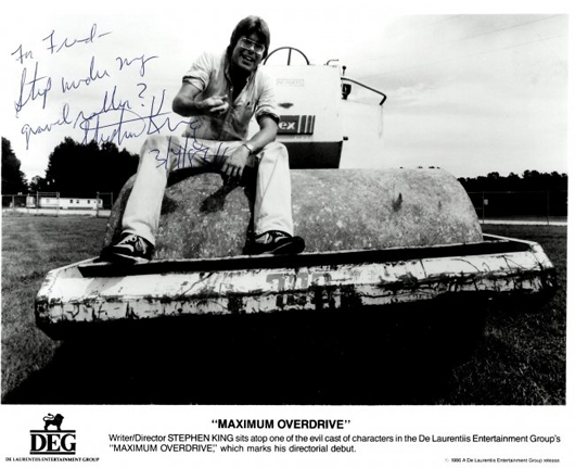 Movie still from the film 'Maximum Overdrive.' Pictured is writer and director Stephen King, who autographed the picture. Image courtesy LiveAuctioneers.com Archive and International Autograph Auctions Ltd.