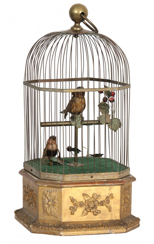 Double singing bird cage automaton in brass cage. The mechanical birds flick their tails, move their heads and whistle a tune. Fontaine’s Auction Gallery image.