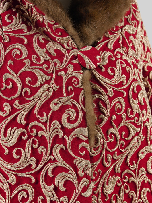Ateliers du Palais de Monaco: (detail) red lame coat with mink collar. © Consulate General of Monaco New York.