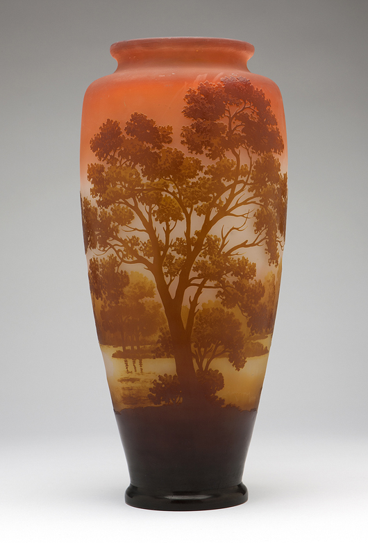 Measuring 17 1/2 inches in height, this Galle cameo glass vase depicts a serene waterside landscape (estimate: $3,000-$5,000). John Moran Auctioneers image.