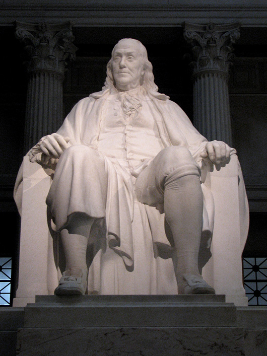 The Benjamin Franklin National Memorial features a 20-foot-high marble statue of the Founding Father sculpted by James Earle Fraser. MikeParker at en.wikipedia.