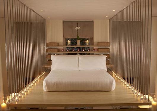 The raised-platform bed and Hollywood lights in this bedroom at the Hempel Hotel would bring out the rock star in anyone.
