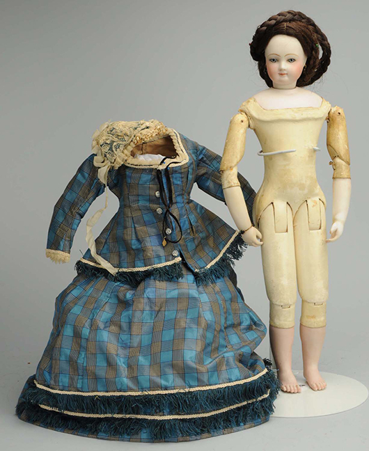 French fashion lady doll, 17in tall, bisque head, shoulder plate, arms and lower legs on kid-over-wood body, est. $4,000-$5,000. Morphy Auctions image.