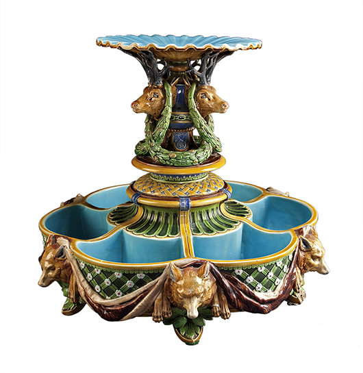 Why an ice stand would be decorated with stag heads and wolves is a mystery, but this 14-inch-high piece of majolica, used to serve dessert, sold for $8,610 at Neal Auction Co. in New Orleans.