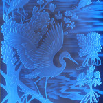 Detail of tropical design in etched, carved and illuminated glass from memorial created by Peter Edward Jurgens. Courtesy Krystal Glass Co.