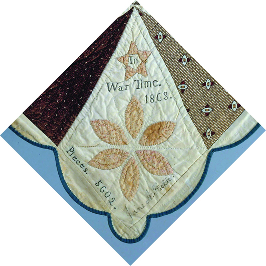 Embroidered on one of the blocks of the Jane Stickle quilt is the phrase: 'In War Time 1863.' Created by Jane A. Stickle. Collection of the Bennington Museum.