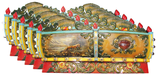 Set of five early 20th century C.W. Parker carousel wood facias, all with different scenes. Estimate: $15,000-$20,000. Showtime Auction Services image.