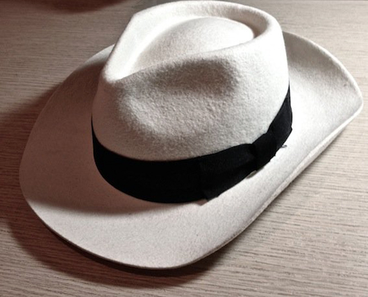 Custom-made white ‘Smooth Criminal’ fedora worn by Michael Jackson during his 1988 Bad tour. Inside hatband is stamped in gold ‘Michael Jackson.’ Est. £4,000-£6,000. Image courtesy LiveAuctioneers and The Fame Bureau.