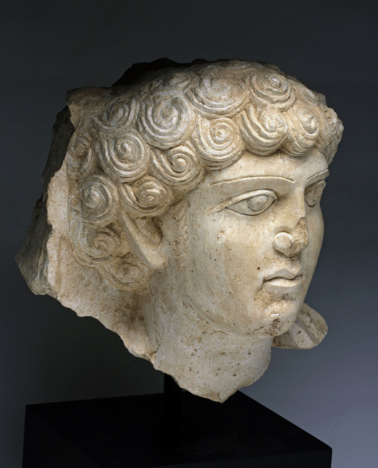 Limestone relief head of a young man, possibly a nobleman, Palmyra, Roman Period, circa 2nd-3rd century. Estimate $20,000-$25,000. Antiquities Saleroom image.