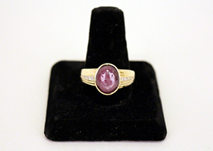 Star ruby and diamond spiritual ring owned and worn by Elvis Presley, later gifted to his bodyguard Sam Thompson. Ahlers & Ogletree image.