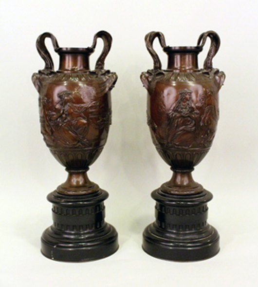 Pair of bronze and marble handled urns with figural relief scenes of young Neoclassical women, marked ‘Barbedienne.’ Ahlers & Ogletree image.