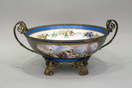 Sevres bronze mounted center bowl with exterior scenes of a couple courting and women picking fruit and flowers. Ahlers & Ogletree image.
