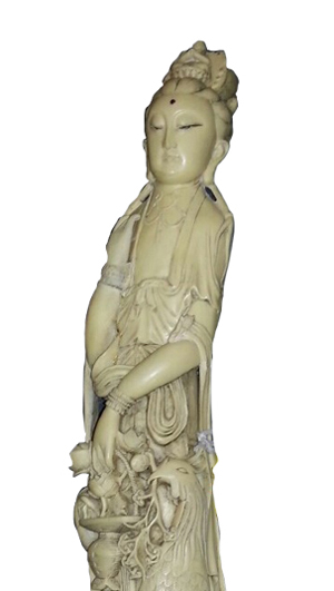 Ivory statue of Asian woman with peacock, 25in tall by 5in wide with red stone in forehead. Stampler Auctions image.